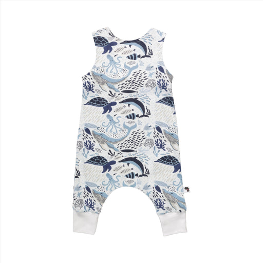 Back view of a harem romper with an ocean-themed pattern featuring various sea creatures including whales, dolphins, turtles, and octopuses in shades of blue and white.