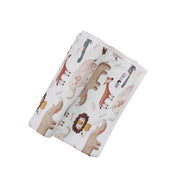 Rolled up Baby Blanket – Okapi with earthy safari animal print on white cotton.