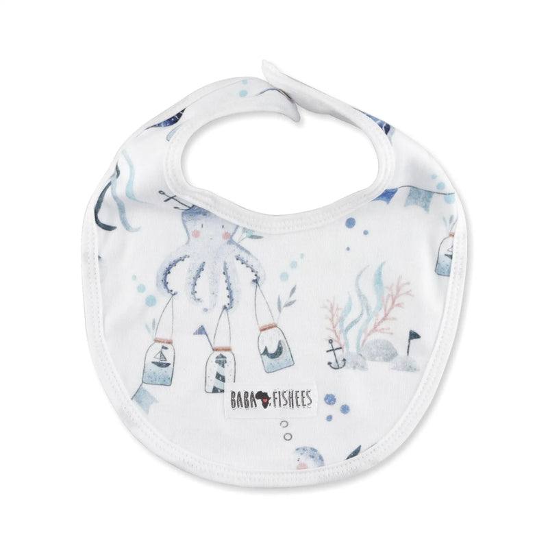 Classic Bib – Otto the Octopus with soft blue ocean-themed print featuring octopus and sea elements.