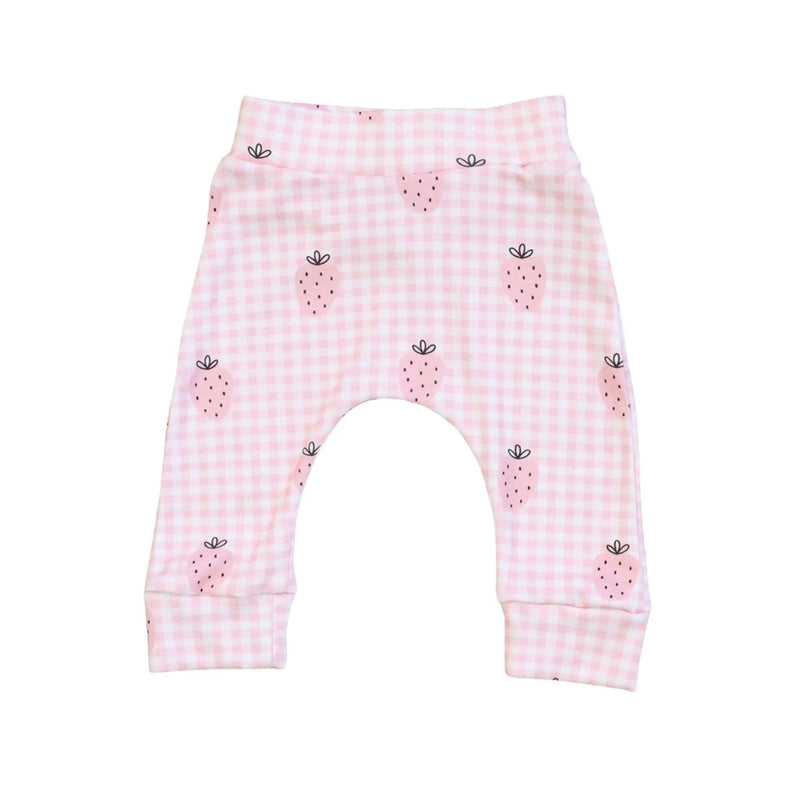 Pink checkered baby pants with strawberry pattern on a white background