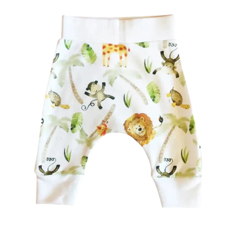 Baby cuff pants featuring a watercolour safari print with lions, giraffes, monkeys, and tropical greenery, designed for comfort and style.