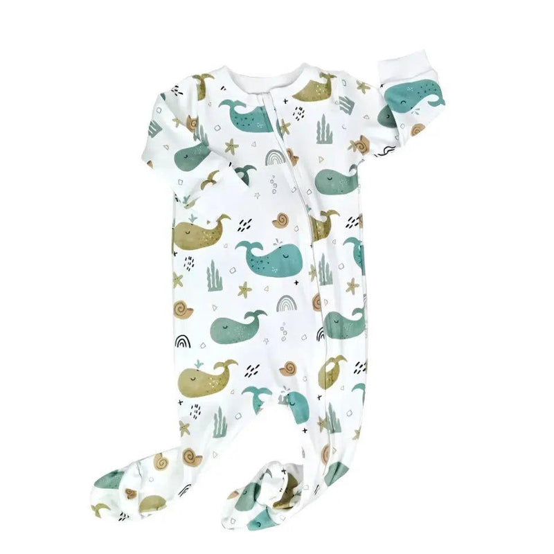 A footy romper featuring a whimsical whale print on a white background, crafted from 100% cotton interlock weighing 200 grams, with full foot coverage.