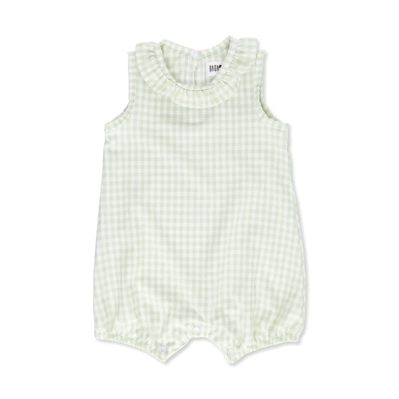 Front view of a frilly neck romper with a classic gingham print in
