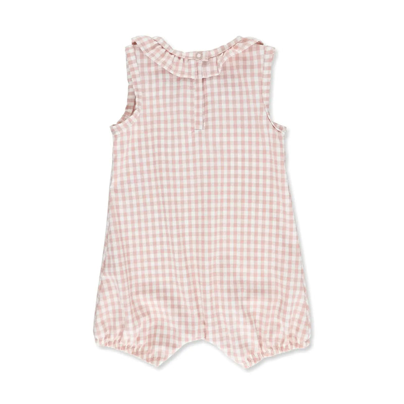 Back view of a frilly neck romper with a classic gingham print in a dusty pink from BabaFishees