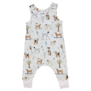 Front view of a White harem romper with a playful dog playground print from BabaFishees.