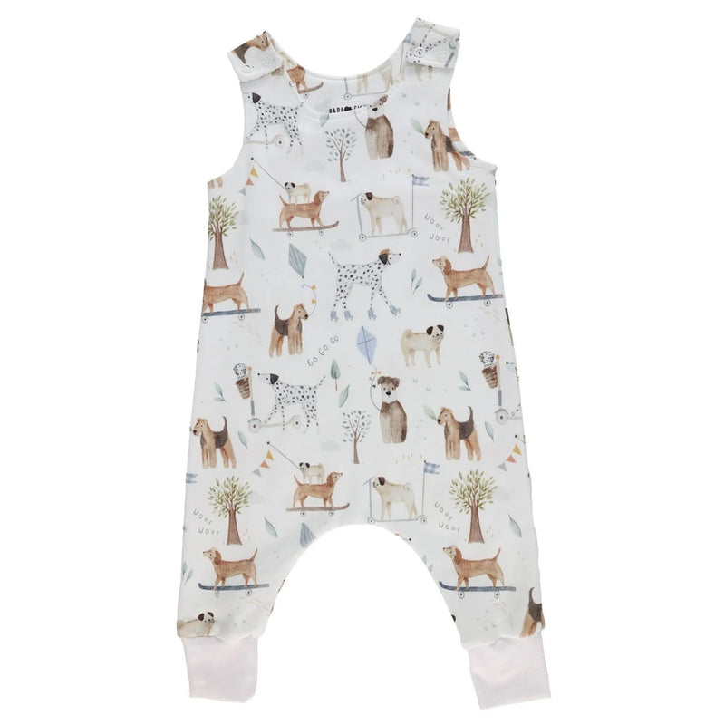 Front view of a White harem romper with a playful dog playground print from BabaFishees.