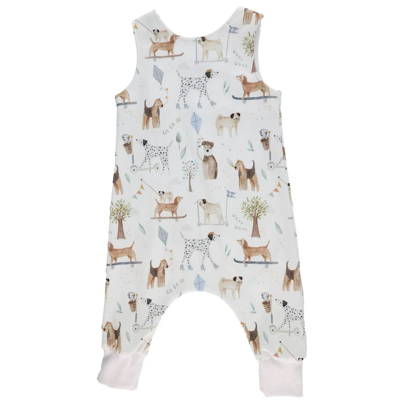 Back view of a White harem romper with a playful dog playground print from BabaFishees.