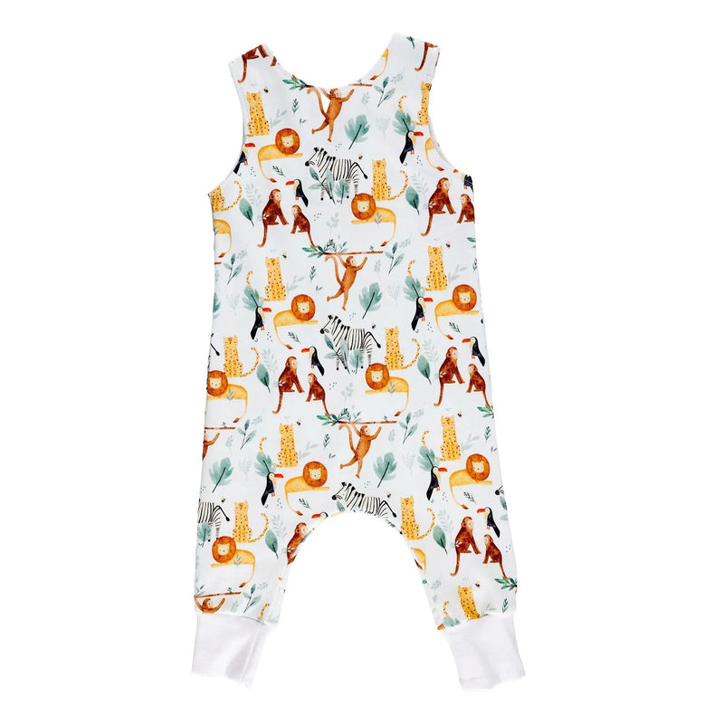 Back view of a harem romper with hand-painted jungle animals, including lions, giraffes, and monkeys, alongside lush tropical greenery on a white stretchy cotton fabric.