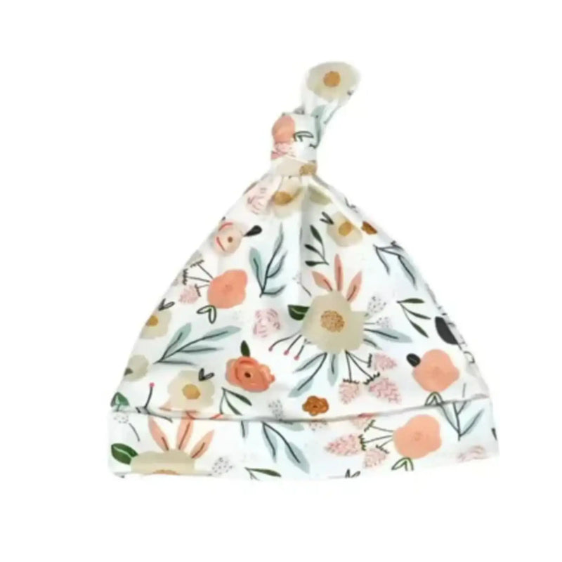 A knot-style baby beanie featuring a pastel floral print, designed for comfort. Perfect for babies first year of life.