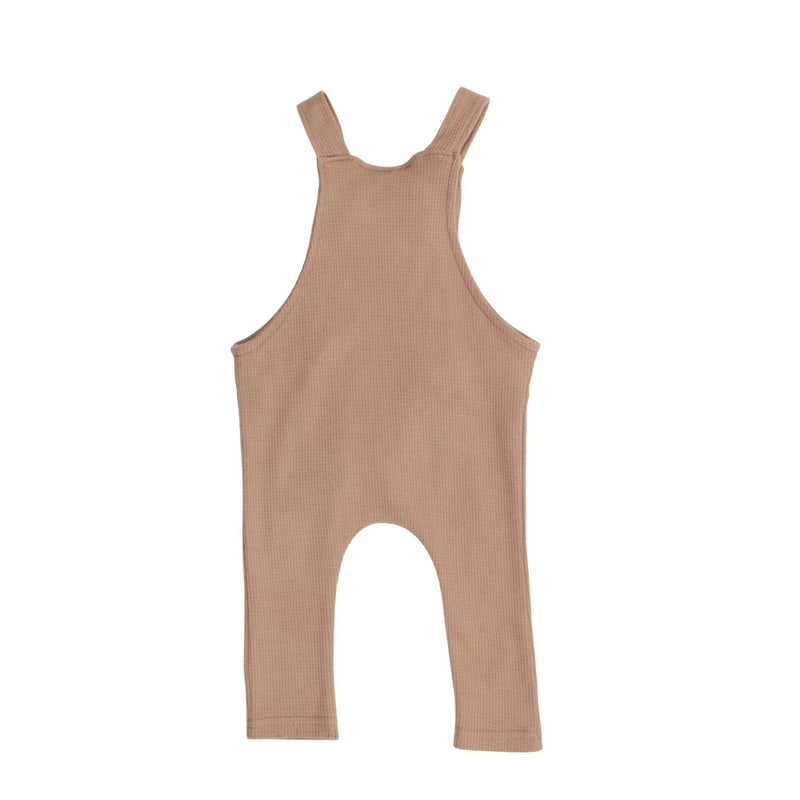 Back View of Knot Dungarees Long Leg in Mocha waffle weave cotton with knotted straps, front pocket, and relaxed fit for easy layering.