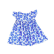 Back view of a white Mocca dress with a vibrant blue floral print and ruffled sleeves from BabaFishees