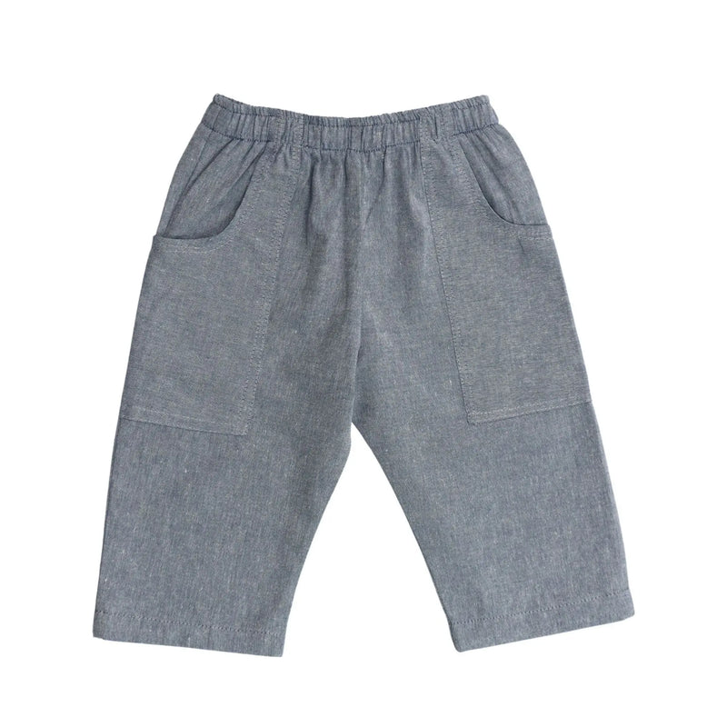 Back view of Relaxed Fit Pants in French Blue cotton chambray with mock tie waistband and long pocket wrapping from side seam to back