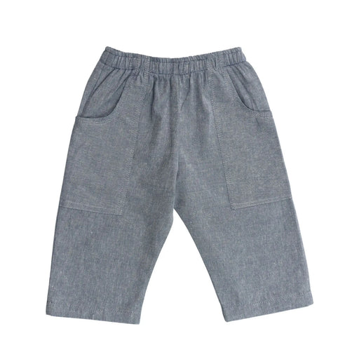 Back view of Relaxed Fit Pants in French Blue cotton chambray with mock tie waistband and long pocket wrapping from side seam to back