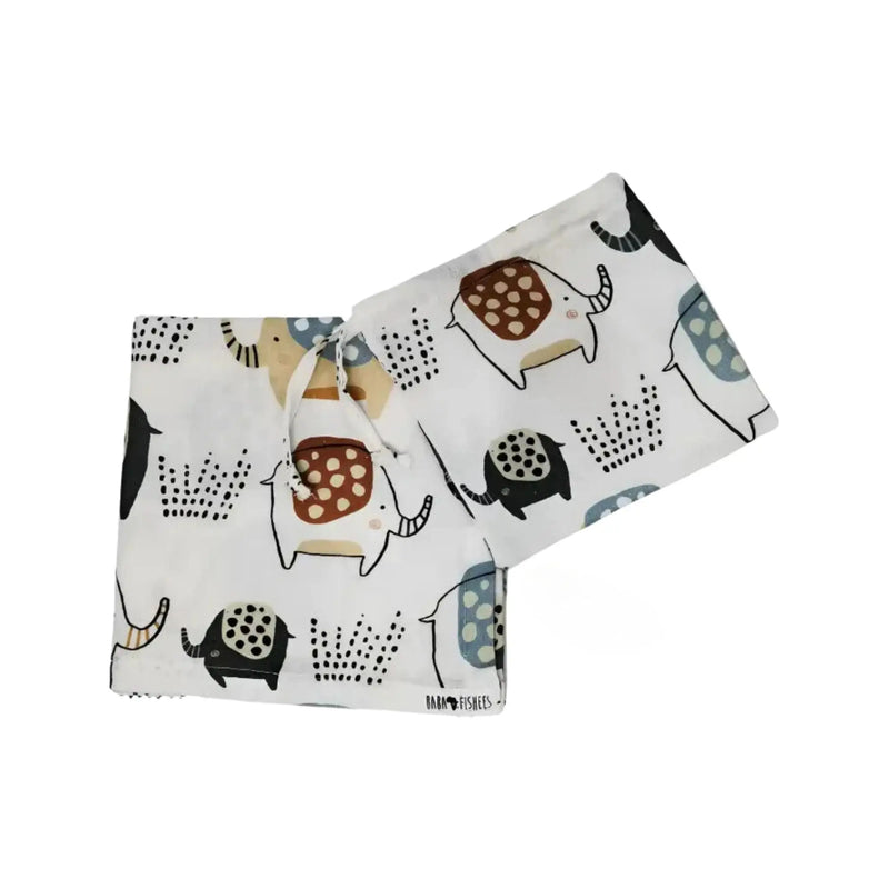 Swaddle Blanket - Edward the Ellie elephant print on white cotton muslin, featuring neutral elephants with dotted details and earthy tones.