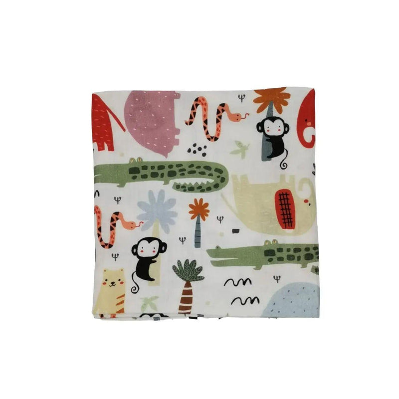 A 100% cotton double muslin swaddle blanket featuring vibrant jungle-themed prints, including elephants, crocodiles, monkeys, and snakes.