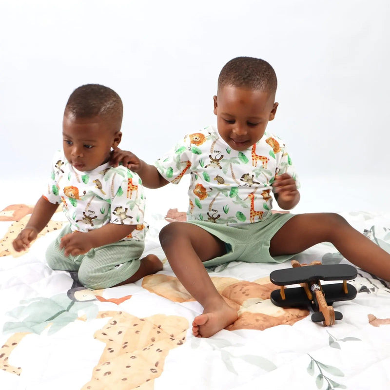 Two children playing with toys wearing Simba Watercolour print tee shirts from Baba Fishees.