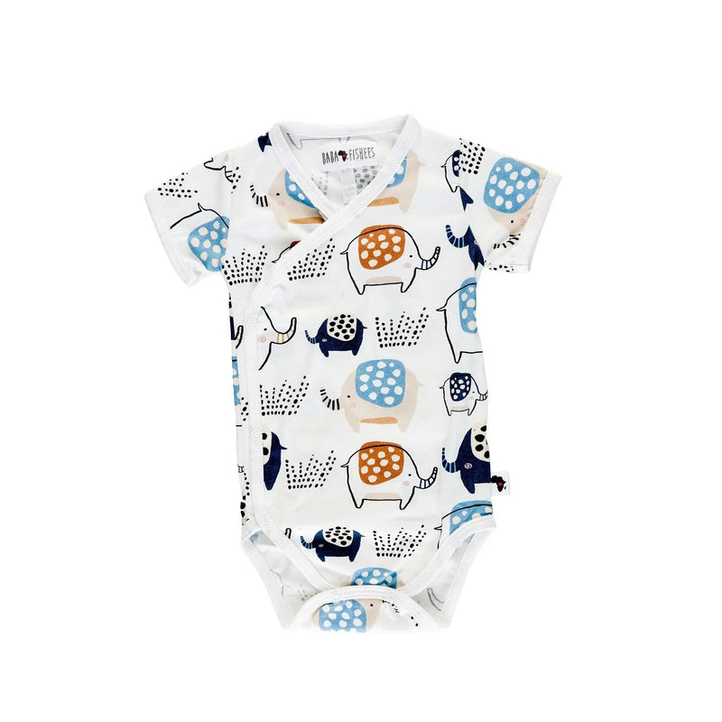 White wrap-style baby onesie featuring a playful elephant print in blue, rust, and navy, with short sleeves and press-stud closures.