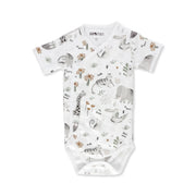 A short-sleeve wrap-style onesie featuring a safari-themed print with animals and plants on a white background, made from 95% cotton and 5% lycra.