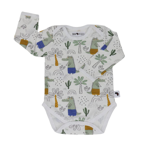 A soft, high-quality long sleeve cotton classic onesie featuring illustrations of a walking crocodile and palm trees and doodles.
