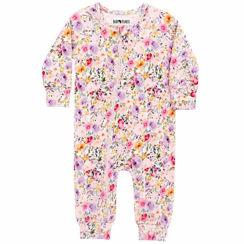 Adapt Romper in Floral Fantasy print with long sleeves, front zip opening, enclosed feet and soft pastel floral design