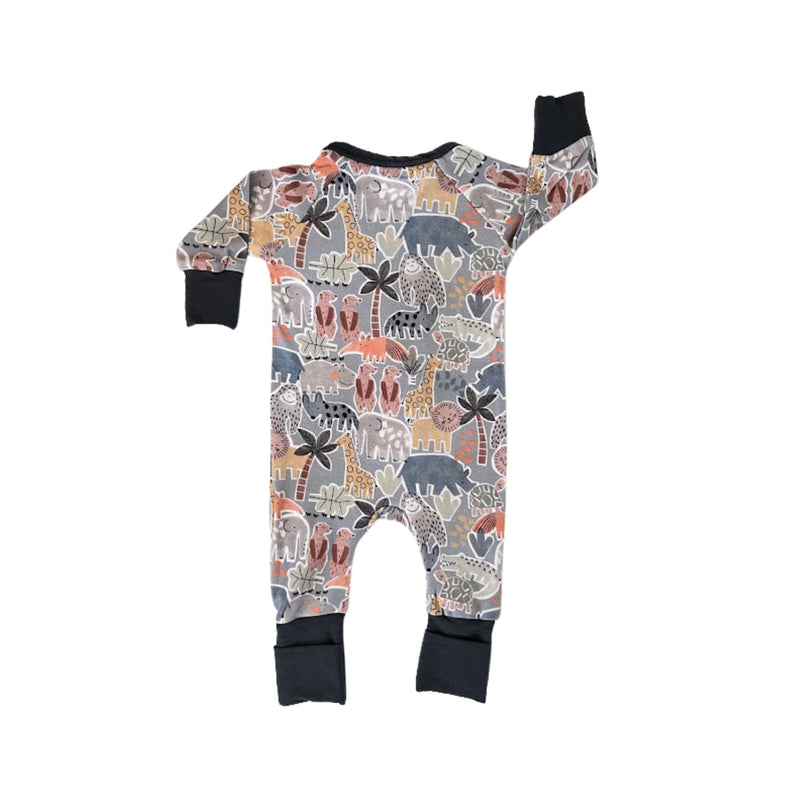 Back view of a baby long-sleeve footy adapt romper one-piece sleeper with an all-over safari animal print, featuring a front double  zipper and solid airforce blue mitten cuffs and neckline.