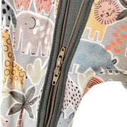 Close-up of a children's double zippered garment featuring a colorful safari animal print with a gray elephant, yellow giraffe, blue elephant, and orange lion on a light gray background.