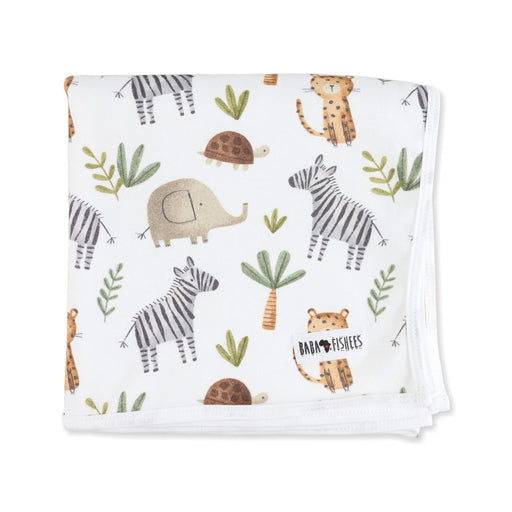 Baby blanket with a pattern of zebras, elephants, tortoises and leopards with palm trees on a white background