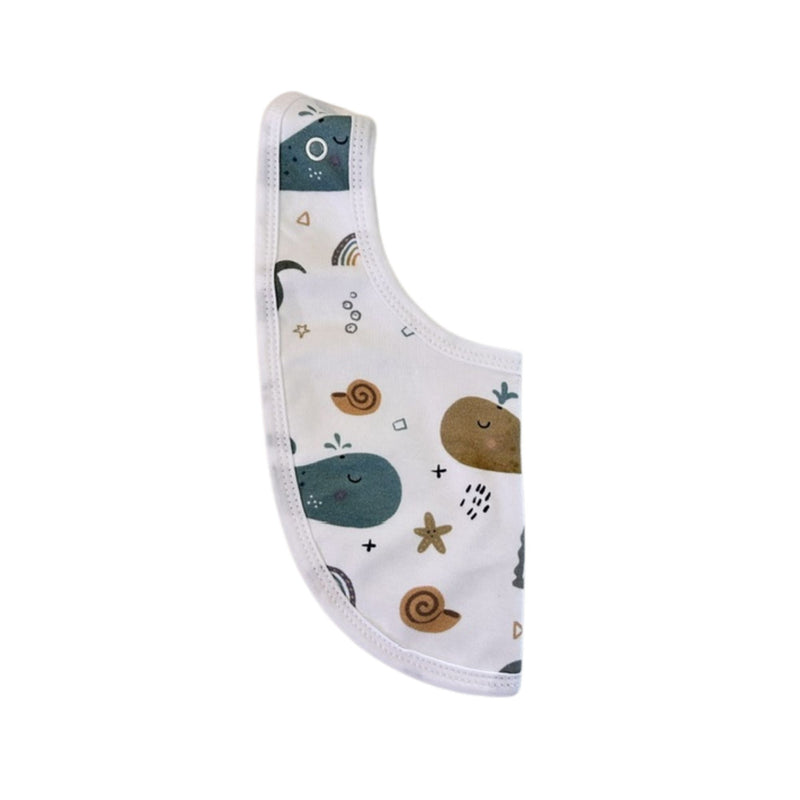 Side view of Bib - Whales on White showing the adjustable press-stud fastening