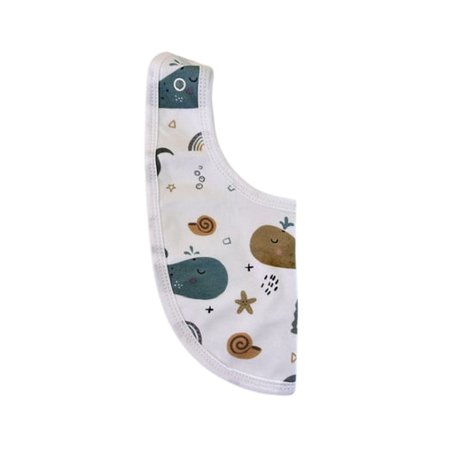 Side view of Bib - Whales on White showing the adjustable press-stud fastening