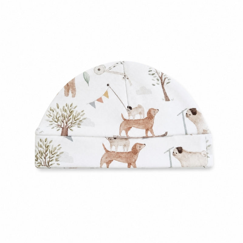 Classic Beanie in white Dogs Playground print with illustrated dogs, trees and soft neutral details