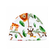 Front view of the Classic Beanie - Simba Watercolour featuring a cheerful lion, giraffe, monkey, turtle, palm trees and green tropical leaves, finished with a wide folded band.