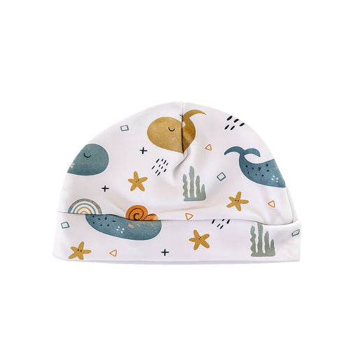 Classic Beanie - Whales on White in white with blue whales, starfish and sea-themed details