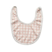 Baby bib with pink and white checkered pattern on a white background