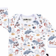 Top close-up of long-sleeve Classic Onesie - Finn and Friends showing the white-bound envelope neckline, long sleeves and Baba Fishees neck label