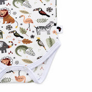 Classic Onesie - African Plains, bottom detail showing two white crotch press studs, stitched leg binding and an Africa side label beside zebra, flamingo and crocodile motifs.