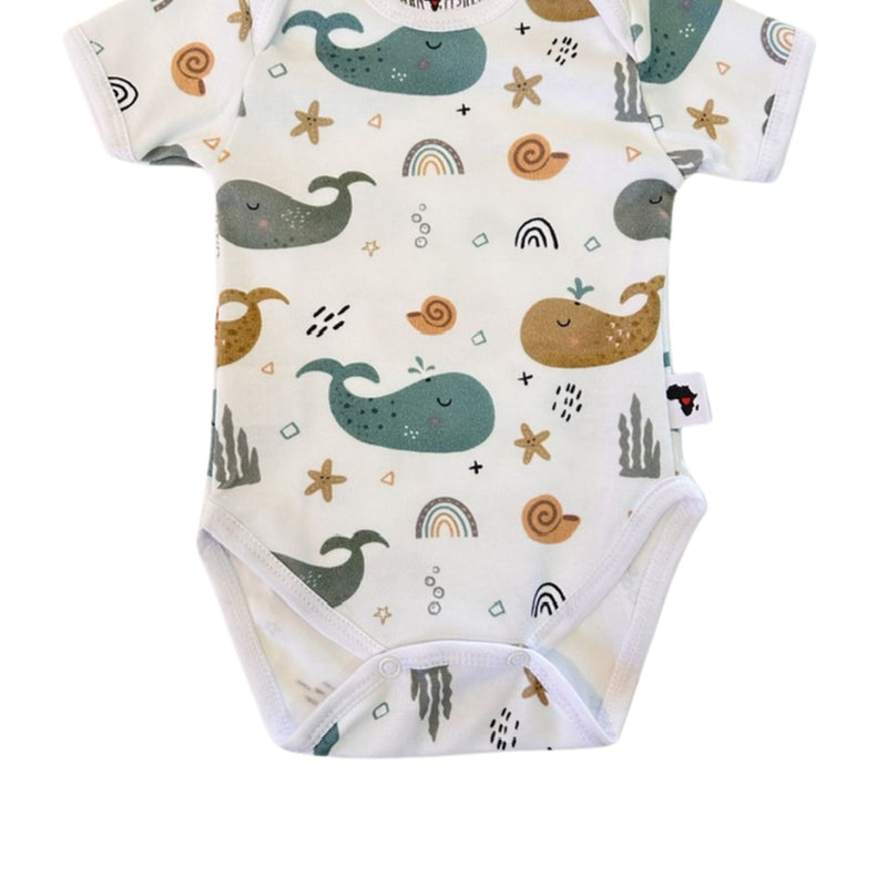 Classic Onesie - Whales on White short-sleeve cotton fabric and colourful whale print close-up