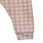 Leg close-up: Close-up of the pink gingham fabric and cuffed ankle on the Comfy Pants - Gingham