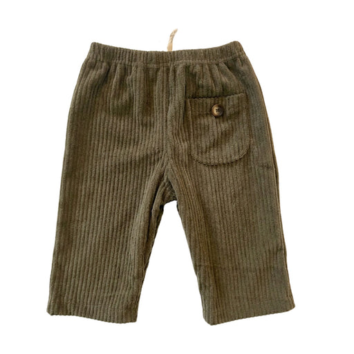 A pair of olive green corduroy pants for toddlers, featuring an elastic waistband, a side pocket with a decorative button, and ribbed fabric.