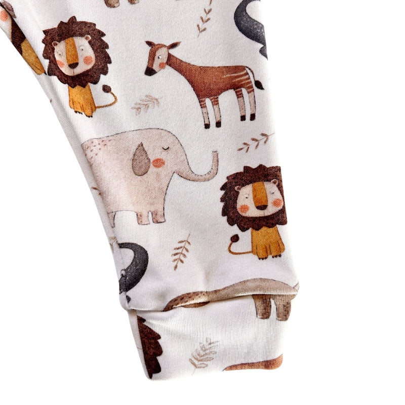 Cuff Pants - Okapi in white with okapi, elephant, lion, rhino and crocodile print and cuffed ankles - leg cuff up close