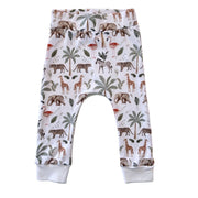 White baby pants with an all-over safari animal print including giraffes, elephants, zebras, flamingos, and palm trees, finished with ribbed ankle cuffs.