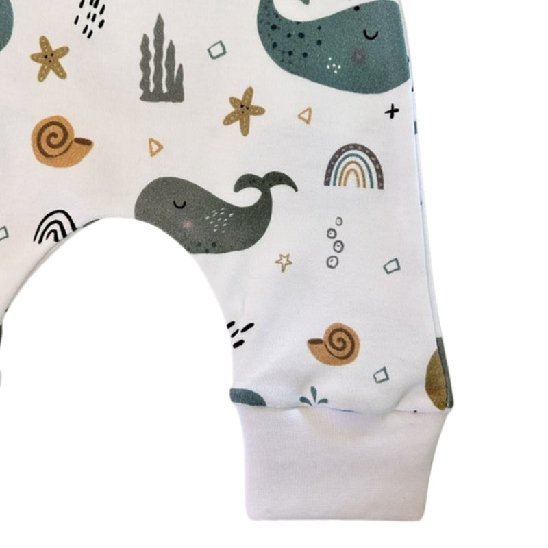 Cuff Pants - Whales on White soft white ankle cuff and colourful whale print close-up