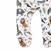 Close-up of the built-in footies on the African Plains Footy Romper, featuring lions, elephants, zebras, giraffes, birds and leafy details on white cotton fabric.