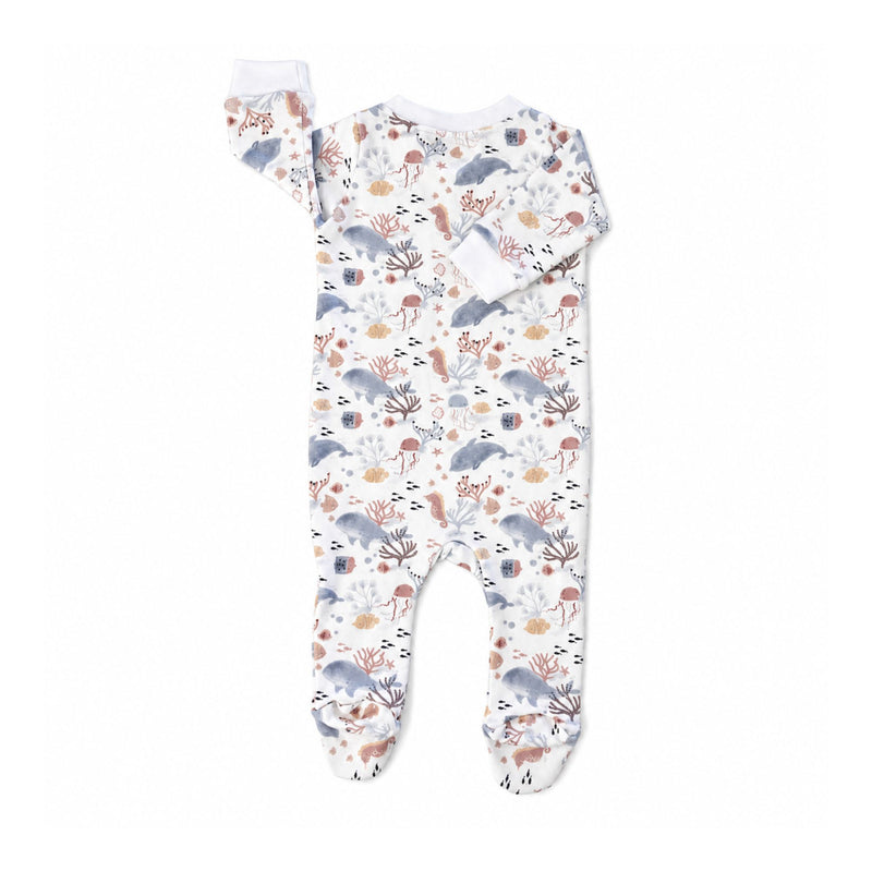 Back of white Finn and Friends footy romper with blue-grey dolphins, pink sea creatures and coral, long sleeves, white cuffs and enclosed feet.