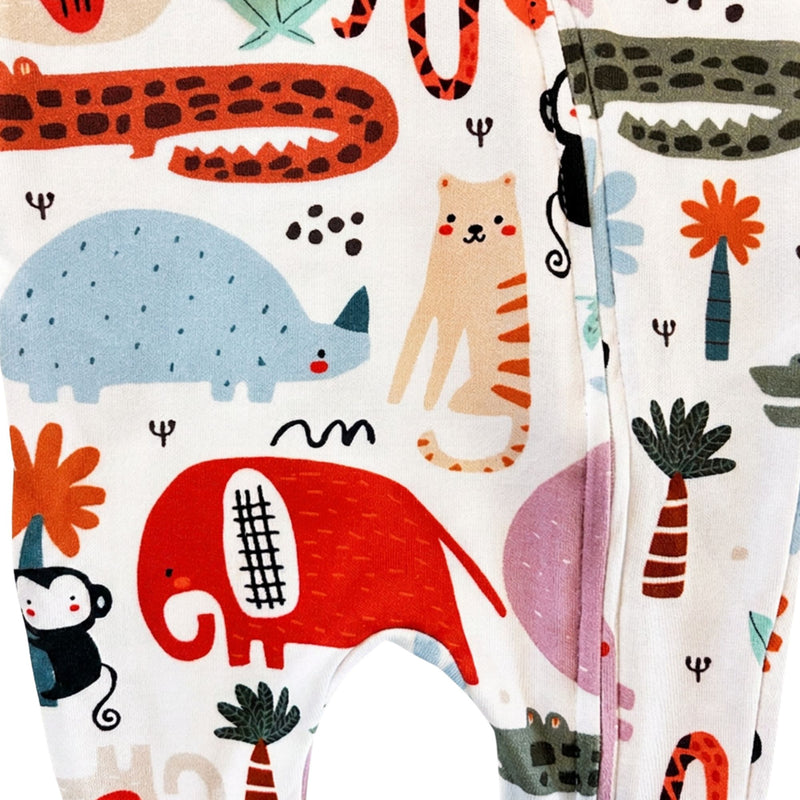 White Footy Romper - Rust Ellie.The print includes a red elephant, blue hippo, orange tiger, black monkey, green crocodile, and palm trees.
