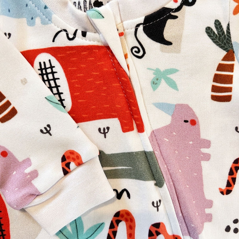 White Footy Romper - Rust Ellie with colourful elephants, hippos and crocodiles -= closeup of zip protector