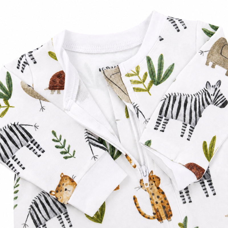 Closeup view of a White footy romper featuring a playful Zebra Party print with zebras, elephants, cheetahs, and tortoises from Baba Fishees