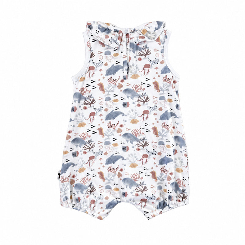 A sleeveless baby romper with a ruffled collar featuring an all-over dolphins and sea life print on a white background.