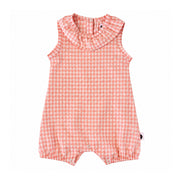 Frilly Neck Romper in peach gingham with tiny white textured dots, a ruffled neckline, sleeveless arms, elasticated leg openings and three crotch press studs.