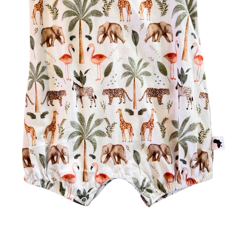 Close-up of the Two By Two Frilly Neck Romper showing the crotch press studs, elasticated leg openings and Baba Fishees side label