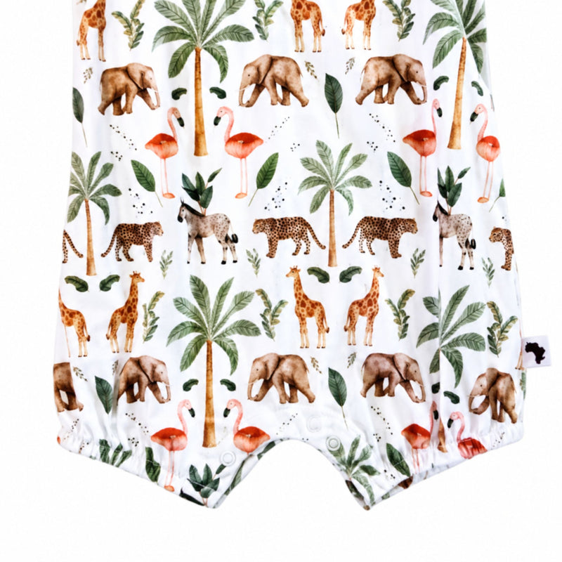 Close-up of the Two By Two Frilly Neck Romper showing the crotch press studs, elasticated leg openings and Baba Fishees side label